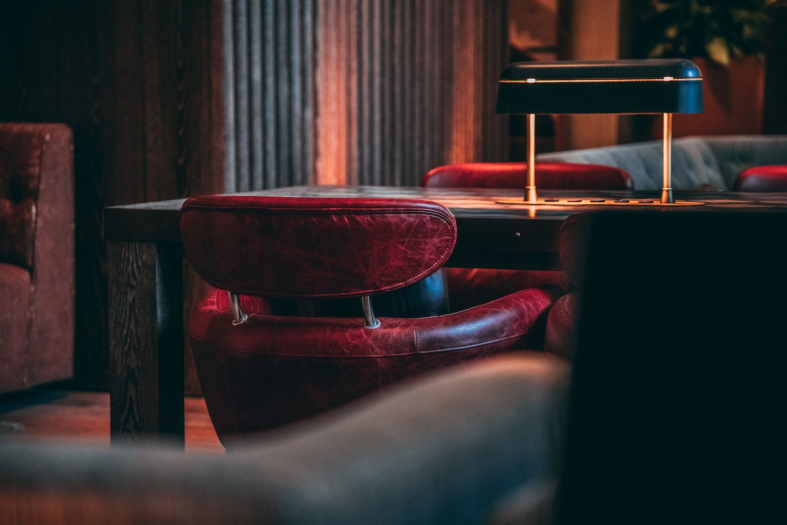 Photo by Pontus Wellgraf brown leather padded chair with stainless steel base